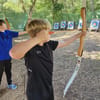 Archery target practice at Adventure Now Manchester