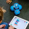 Child coding with robot at Blueshift Education