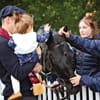 Family meeting racehorse at Ascot Racecourse