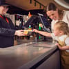 Family buying snacks at Vue Cinema