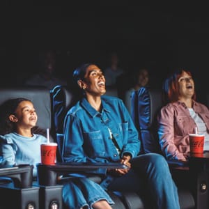 Family enjoying a film at ODEON Cinema