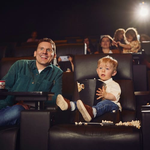 Parent and child watching a movie at Vue Cinema