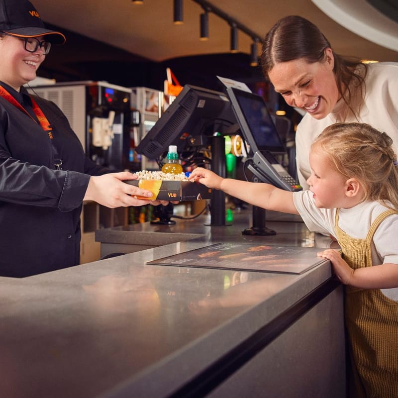 Family buying snacks at Vue Cinema