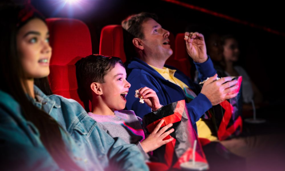 Family enjoying a cinema trip on a rainy day