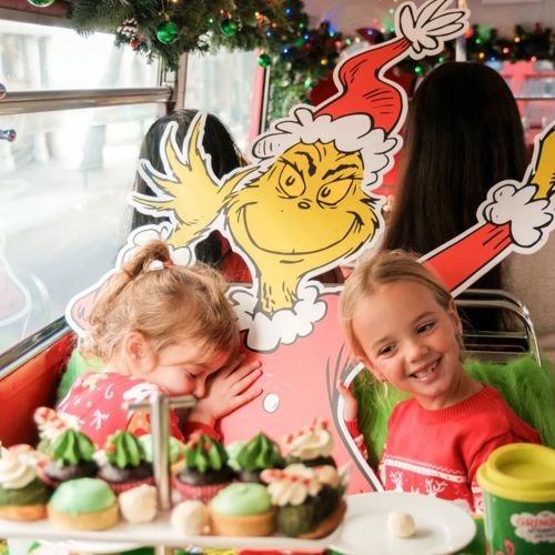 Children enjoying Grinch-themed afternoon tea in London