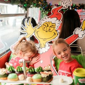 Children enjoying Grinch-themed afternoon tea in London