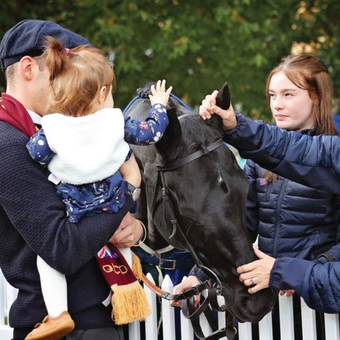 Family meeting racehorse at Ascot Racecourse