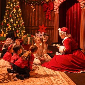 Children enjoying Christmas storytelling with Santa