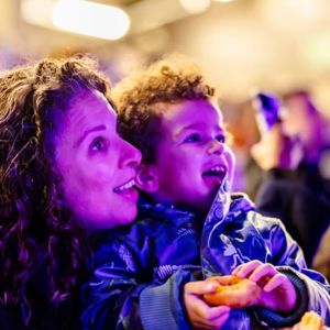 Parent and child watching WILD Drone Light Show Ipswich